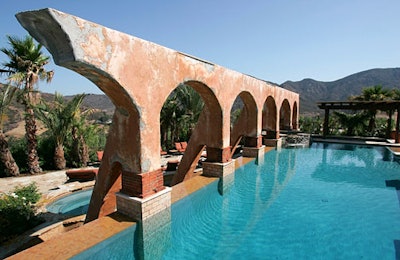 The vast mansion evoked a centuries-old Spanish style.