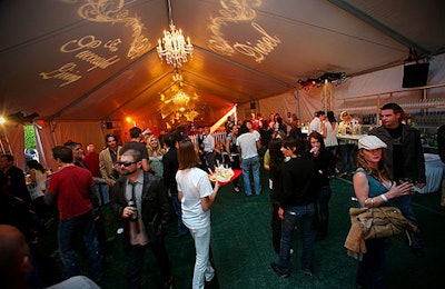 Fake grass lined the interior of the tent, while chandeliers and Diesel gobos decorated its ceilings.