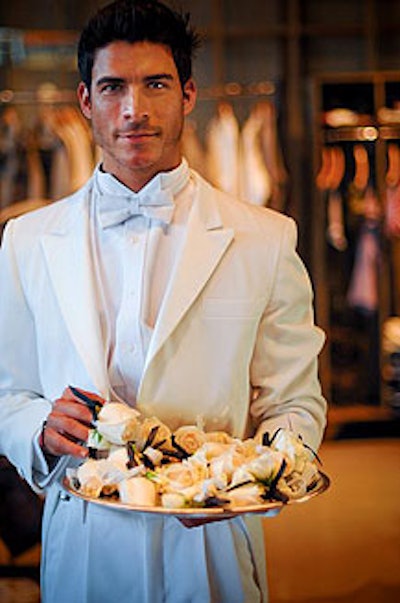 Guests stepping into the new store received white rose corsages or boutonnieres.