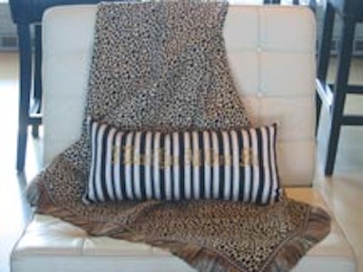 Designer Nicholas Pinney created pillows with black and white stripes similar to the visual design on the L.A.M.B. Web site.