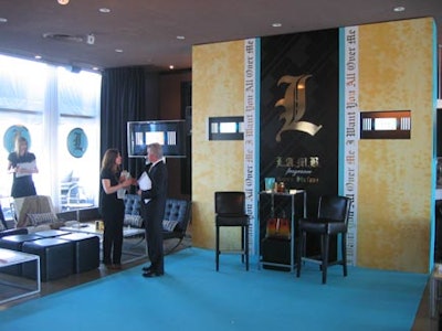 Round turquoise posters of the L-shaped logo that represents Stefani’s L.A.M.B. perfume decorated the windows.