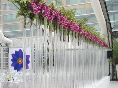 San Remo Florists and McNabb Roick Events created a wall of glass and flowers to divide the dinner space from the cocktail lounge.
