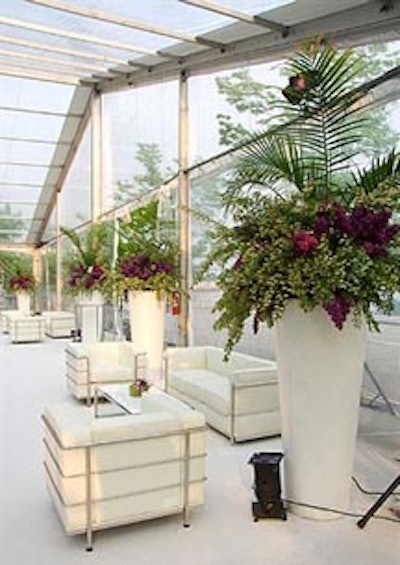 Massive white urns filled with lush summer foliage in the Telus colours were placed in the lounge area by San Remo florists.