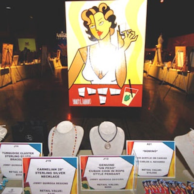 A silent auction area at the center of the room offered everything from necklaces and art posters to custom-made evening gowns and an autographed domino table.