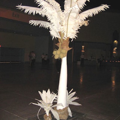 Decorative white trees with fake coconuts helped separate the room's decor from that of other events.