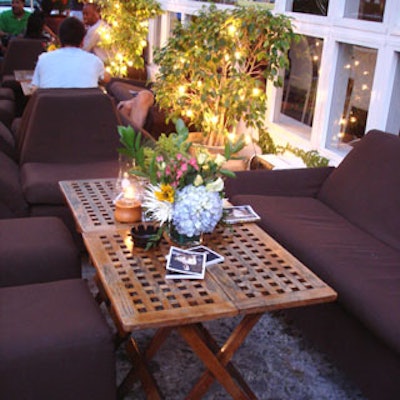 Floral arrangements by Flower Megastore and copies of Six Degrees magazine adorned a table in the sofa-outfitted area of the front patio.