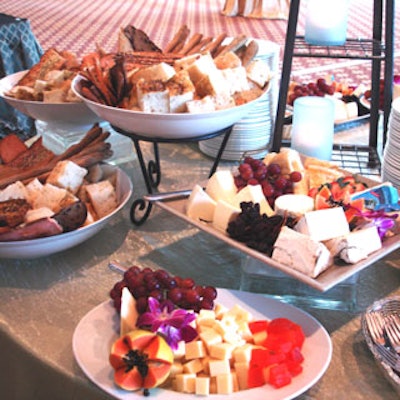 A variety of imported and domestic cheeses, flat breads, and fruits were served on decorated tables during the cocktail hour.