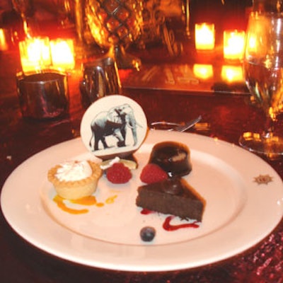 The final course featured a trio of desserts with mini cheesecake, key lime pie, and mocha cheesecake with a white chocolate disk imprinted with a chocolate elephant.