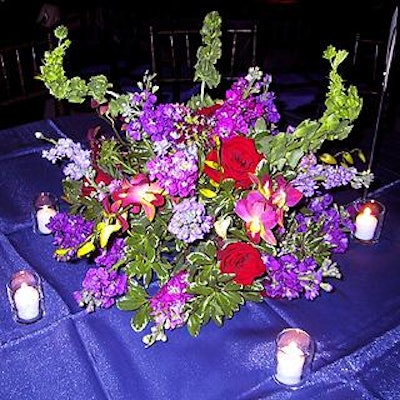 Glen Craig of Craig & Company provided beautiful centerpieces, which included red roses, stock, dendrobium orchids and phlox.