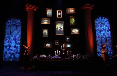 Antique silver candelabras topped 19th-century mahogany tables in the interior space, which featured decorative gargoyles, stained-glass windows, columns, and moving portraits.