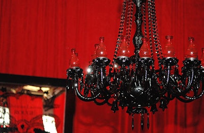 Twenty bottles of Rouge perfume replaced lightbulbs in the sockets of the room's focal Murano glass chandelier.