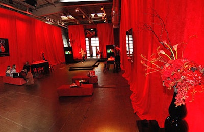 Red curtains draped every wall and parted only at the runway's entrance.