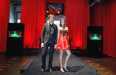 Two models (the woman clad in a Lacroix dress) escorted guests from the backstage check-in down the runway to the party on the floor.