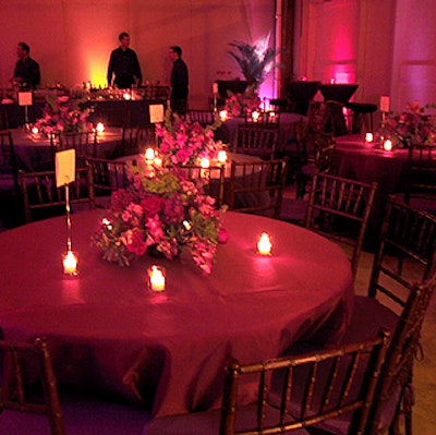 The tables were draped with shimmering table linens provided by Broadway Famous Party Rentals, and centerpieces by Glen Craig of Craig & Company featured red roses, dendrobium orchids, and purple and lavender stock and phlox.