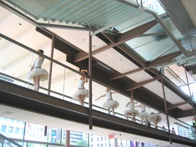 Ballerinas from the Hit and Run dance company performed on a second-floor catwalk.