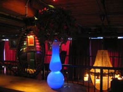 Lights of changing colours lit the inside of tall glass vases topped by floral arrangements.