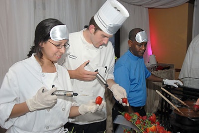 Chefs at the strawberry injection station in the Dream State room injected the fruits with Grand Marnier or Godiva chocolate liqueur.