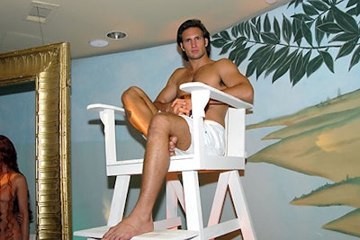 A model-cum-lifeguard was perched atop a tall chair overlooking the Miami-version of 'The Birth of Venus.'