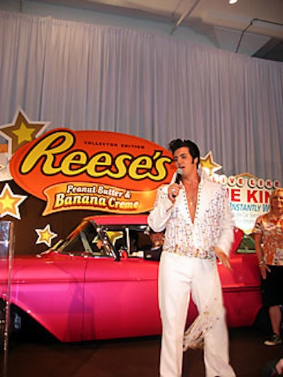 An Elvis impersonator posed with the pink 1957 Cadillac that Boyd Coddington redesigned for the Reese's promotion.