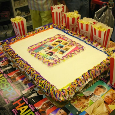 At the start of the event, a white tear-apart cake with the movie's poster centered on the frosting had its first piece pulled by GBS founder Ken Bern.