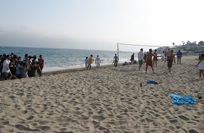 Barefoot paparazzi got their shots alongside a beach volleyball game in which partygoers like Ian Ziering played.