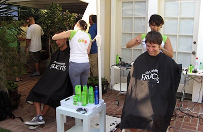 Stylists fussed with guests' hair using Garnier Fructis products.