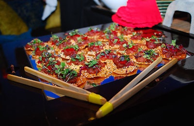 Waiters passed firecracker ahi tuna tartare with chili peppers, lemongrass, soy, habanero masago, and sesame wonton.