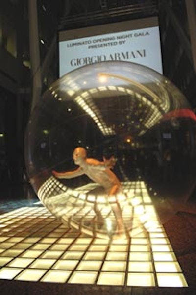 A performance artist in a large clear sphere entertained guests by rolling along the floor in Allen Lambert Galleria at BCE Place for Luminato’s official launch party.