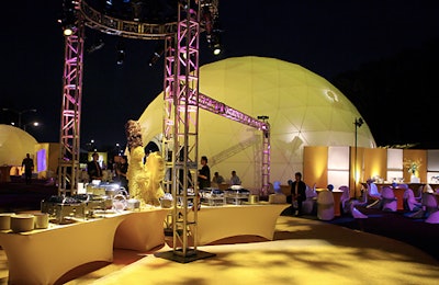 A yellow theme dominated the after-party, where geodesic domes were illuminated with yellow lighting, and topiaries of the characters in the same shade topped buffet tables.