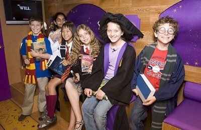 The triple-decker bus, described as a roving studio, featured wood paneling, purple accents, and stars, which many children said was identical to J.K. Rowling’s version.