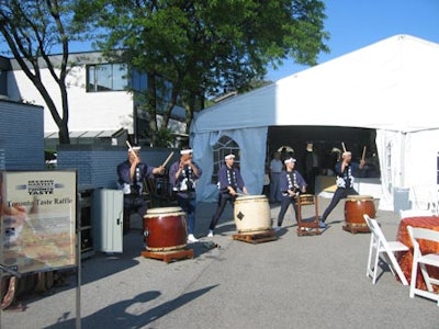The Kiyoshi Nagata Ensemble, Japanese Taiko drummers, performed outside the dessert tent.