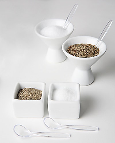 These tiny tasting plates can take on new tasks. The porcelain cube and cone-shaped cup from Party Rental Ltd. rent for $1 apiece; the transparent Lucite salt spoons also rent for $1 each.