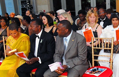 More than 200 attendees sat atop red-cushioned gold chairs from USA Party Rentals.