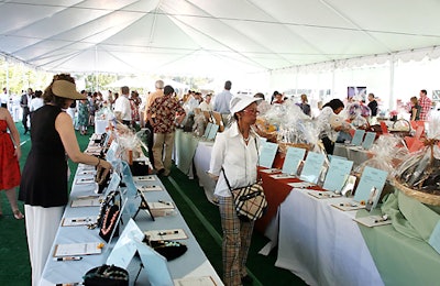 Guests could peruse more than 100 silent-auction items under an awning that protected them from the summer sun.