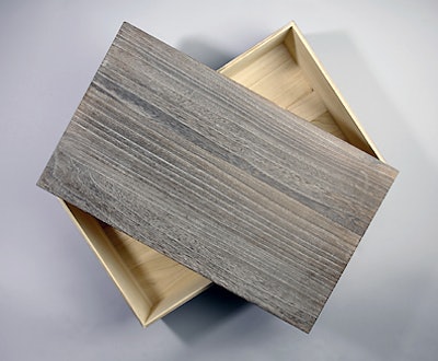 A sturdy weathered gray feathergrain wooden chest from the Container Store is a handsome way to present goodies.
