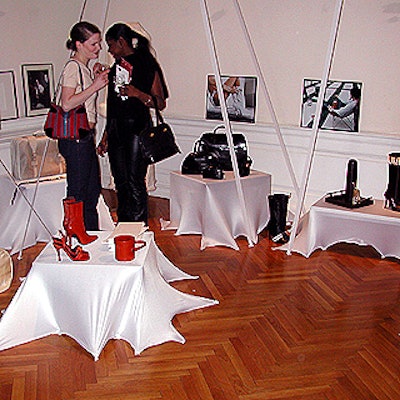 Mariano Airaldi covered the display tables with white fabric stretched to the floor at the Argentinean fashion showcase at the Argentinean consulate.
