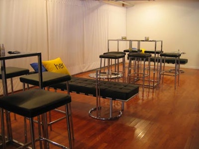 Black and silver cocktail furniture with stools and square tables were accented by low lying day beads from Furnishings By Corey.