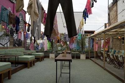 Signature Rentals used vintage duds on overhead clotheslines to create a sixties aesthetic on the roof-top patio of the Drake Hotel.