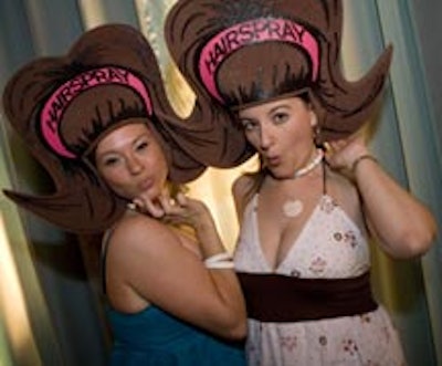 Guests posed for pictures wearing foam 'big hair' accessories.
