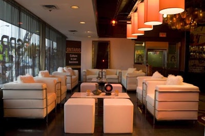 Furnishings from Signature Rentals in white decorated the lounge area with mini record centrepieces.