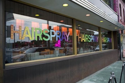 Outside the hotel windows were covered with colourful lettering spelling out movie name.