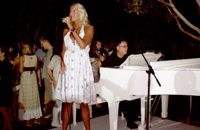 Viktoria Tolstoy sang in a sweet, soft voice alongside a white piano.