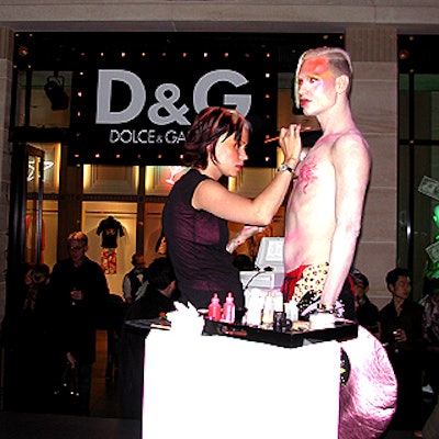 At the D&G party at Henri Bendel, one model pouted for the crowd wearing roller skates, bedazzled chaps and red briefs while a makeup artist applied glittering makeup to his body.
