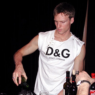 The caterwaiters and bartenders wore white D&G-logoed T-shirts, fashionably slashed and festooned with safety pins by the folks at D&G.