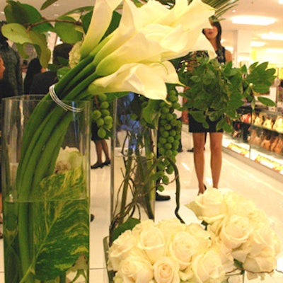White Tulip Florist created white rose and tulip centerpieces for Macy's reopening party.