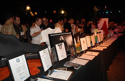 Guests perused rows of silent-auction tables that lined pathways.