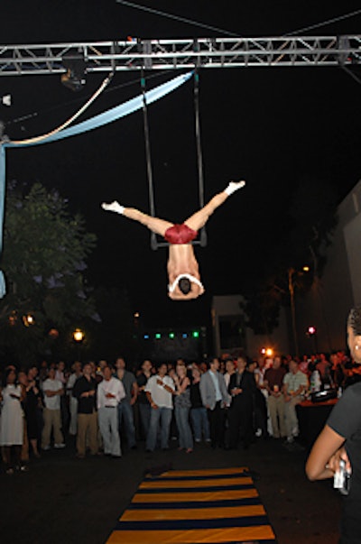 An Eye of Newt aerialist stripped during his trapeze act.