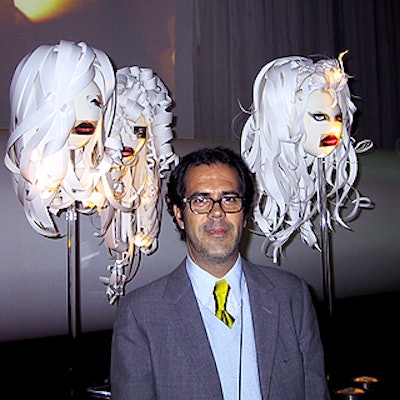 Design consultant Dick Walsh, who worked with M.A.C.'s creative team on the event's decor, posed with some of the papier-mache heads.