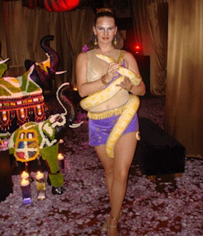 A performer from New Century Dance Company mesmerized guests with her handling of an albino python.