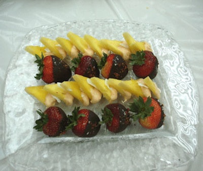 Chocolate-dipped fruits were on hand as guests surveyed the wine room and spirits storage area.